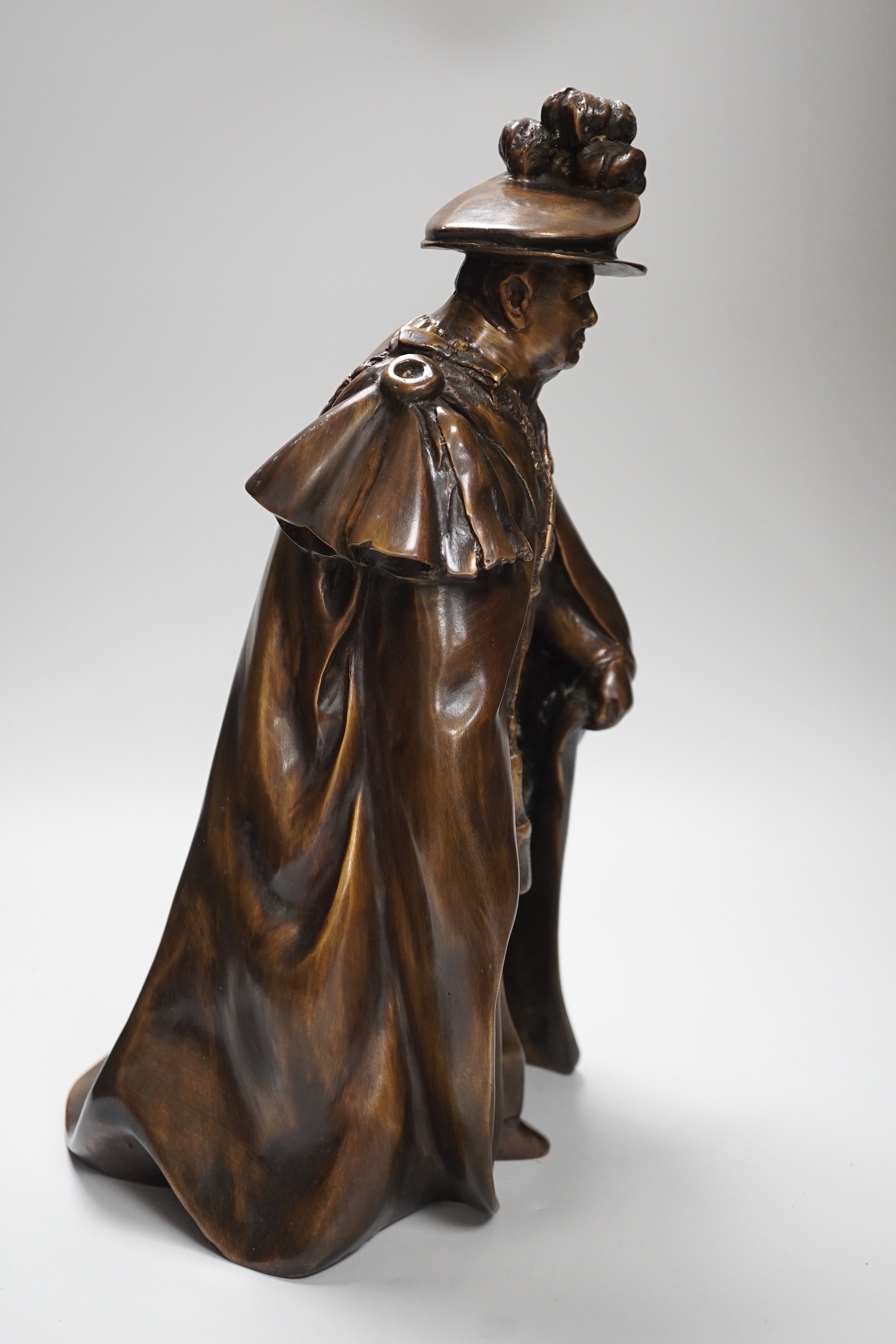 A bronze figure of Winston Churchill wearing the robes of a Knight of the Garter, 38cm